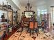 Elegant dining room features a round glass table and rich wood chairs at 221 S Plaza Ct # 107, Mount Pleasant, SC 29464