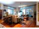 Living room with hardwood floors, comfortable seating, and access to balcony at 221 S Plaza Ct # 107, Mount Pleasant, SC 29464