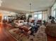 Spacious living room with hardwood floors, comfortable seating, and large windows at 221 S Plaza Ct # 107, Mount Pleasant, SC 29464