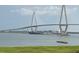 Stunning view of Arthur Ravenel Jr. Bridge and a cargo ship at 221 S Plaza Ct # 107, Mount Pleasant, SC 29464
