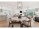 Bright dining area with marble table, modern chairs, and open kitchen view at 2584 Helmsman Rd, Johns Island, SC 29455