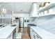 Modern kitchen with white cabinets, marble countertops, and stainless steel appliances at 306 Ripple Park Dr, Summerville, SC 29486