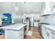 Modern kitchen with white cabinets, marble countertops, and stainless steel appliances at 306 Ripple Park Dr, Summerville, SC 29486