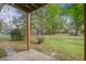 Spacious backyard with lush green grass and mature trees at 309 Canaberry Cir, Summerville, SC 29483