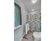 Bathroom with shower and beach-themed curtain at 317 W Hudson Ave, Folly Beach, SC 29439