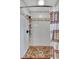 White subway tile shower with pebble floor and updated shower fixture at 317 W Hudson Ave, Folly Beach, SC 29439
