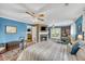 Primary bedroom with fireplace and access to private deck at 317 W Hudson Ave, Folly Beach, SC 29439