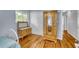 Light blue walls and hardwood floors create a serene feel in this bedroom at 317 W Hudson Ave, Folly Beach, SC 29439