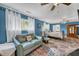 Bedroom with sitting area and blue walls at 317 W Hudson Ave, Folly Beach, SC 29439