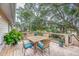 Relaxing deck with seating area, lush greenery, and tranquil wooded views at 317 W Hudson Ave, Folly Beach, SC 29439