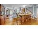 Charming dining area with a unique wooden island and hardwood floors at 317 W Hudson Ave, Folly Beach, SC 29439
