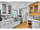 Modern kitchen with stainless steel appliances and white cabinetry at 317 W Hudson Ave, Folly Beach, SC 29439