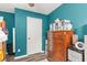 bedroom with a dresser, teal walls, and plenty of storage at 325 Parish Parc Dr, Summerville, SC 29485