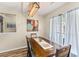 Dining area with wood table and built-in bench seating near window at 325 Parish Parc Dr, Summerville, SC 29485