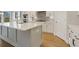 Large kitchen island with white cabinets and quartz countertop at 344 Trailmore Ln, Summerville, SC 29486