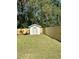 Private backyard with wooden fence and storage shed at 413 Madeline Dr, Goose Creek, SC 29445