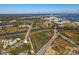 Aerial view showcasing home's location near waterway and rail lines at 4156 O'Hear Ave, North Charleston, SC 29405