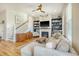 Cozy living room featuring a fireplace, built-in shelving, and comfortable seating at 4156 O'Hear Ave, North Charleston, SC 29405