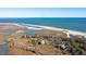 Aerial view of oceanfront property and marsh at 422 Pelican Flight Dr, Dewees Island, SC 29451