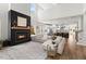 Open living room showcasing a cozy fireplace and a seamless transition to the kitchen at 4312 Cotton Flat Rd, Summerville, SC 29485