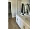 Double vanity bathroom with quartz countertop and black matte fixtures at 445 Carrara Dr, Summerville,  29486