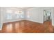 Bright dining room features hardwood floors, plantation shutters, and a view into the kitchen at 5096 Coral Reef Dr, Johns Island, SC 29455