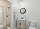 Bathroom with shiplap walls, floating vanity, and walk in shower at 5208 Holly Forest, Hollywood,  29449