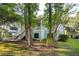 Two story home with front porch and landscaped yard at 5208 Holly Forest, Hollywood,  29449