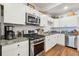 Modern white kitchen with stainless steel appliances at 5208 Holly Forest, Hollywood,  29449