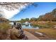 Serene community lake with a fountain and bronze sculptures at 522 Oak View Way, Summerville, SC 29483