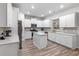 Modern kitchen with white shaker cabinets, stainless steel appliances, and an island at 530 Richfield Way, Summerville, SC 29486