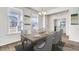 Formal dining room with gray chairs and wooden table at 573 Richfield Way, Summerville, SC 29486