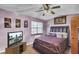 Bedroom with king bed, TV, and window at 7780 Wayfield Cir, North Charleston, SC 29418