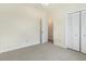 Bedroom with gray carpet, white closet doors, and an adjacent room at 103 Hazelton Ct, Goose Creek, SC 29445