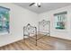 Bright bedroom featuring hardwood floors and an antique metal bed frame at 104 Tanager St, Summerville, SC 29483