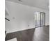 Living room with dark hardwood floors and sliding glass doors at 1077 Marsh Court Ln, Mount Pleasant, SC 29464