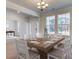 Formal dining room with large square table and hardwood floors at 1096 Keeper Ln, Summerville, SC 29485