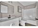 Modern bathroom with white vanity, black fixtures, and a shower/tub at 1243 Pineville Cir, Pineville, SC 29468