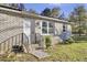 Brick home exterior with a white door and landscaping at 1243 Pineville Cir, Pineville, SC 29468