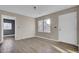 Bright living room featuring wood-look floors and an open layout at 1243 Pineville Cir, Pineville, SC 29468