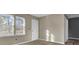 Living room with wood-look floors, neutral walls, and natural light at 1243 Pineville Cir, Pineville, SC 29468