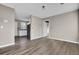 Spacious living room with wood-look floors and neutral walls at 1243 Pineville Cir, Pineville, SC 29468