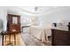 Spacious bedroom with hardwood floors, a king-size bed, and antique furniture at 1597 Kentwood Cir, Charleston, SC 29412