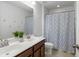 Clean bathroom with double vanity and shower/tub combo at 192 Lindera Preserve Blvd, Summerville, SC 29486