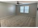 Large bedroom with neutral walls and carpet flooring and two windows at 192 Lindera Preserve Blvd, Summerville, SC 29486