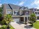 Two-story home with brick and siding, gray roof, and palm trees at 192 Lindera Preserve Blvd, Summerville, SC 29486