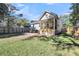 Home exterior showcasing a screened porch and patio at 2105 Bradham Rd, Charleston, SC 29412