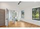 Bright bedroom with hardwood floors and access to a bathroom at 38 N Enston Ave, Charleston, SC 29403