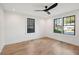 Bright bedroom with hardwood floors and large windows at 38 N Enston Ave, Charleston, SC 29403