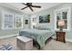 Light and airy bedroom with a ceiling fan and coastal decor at 4028 Bridle Trail Dr, Seabrook Island, SC 29455